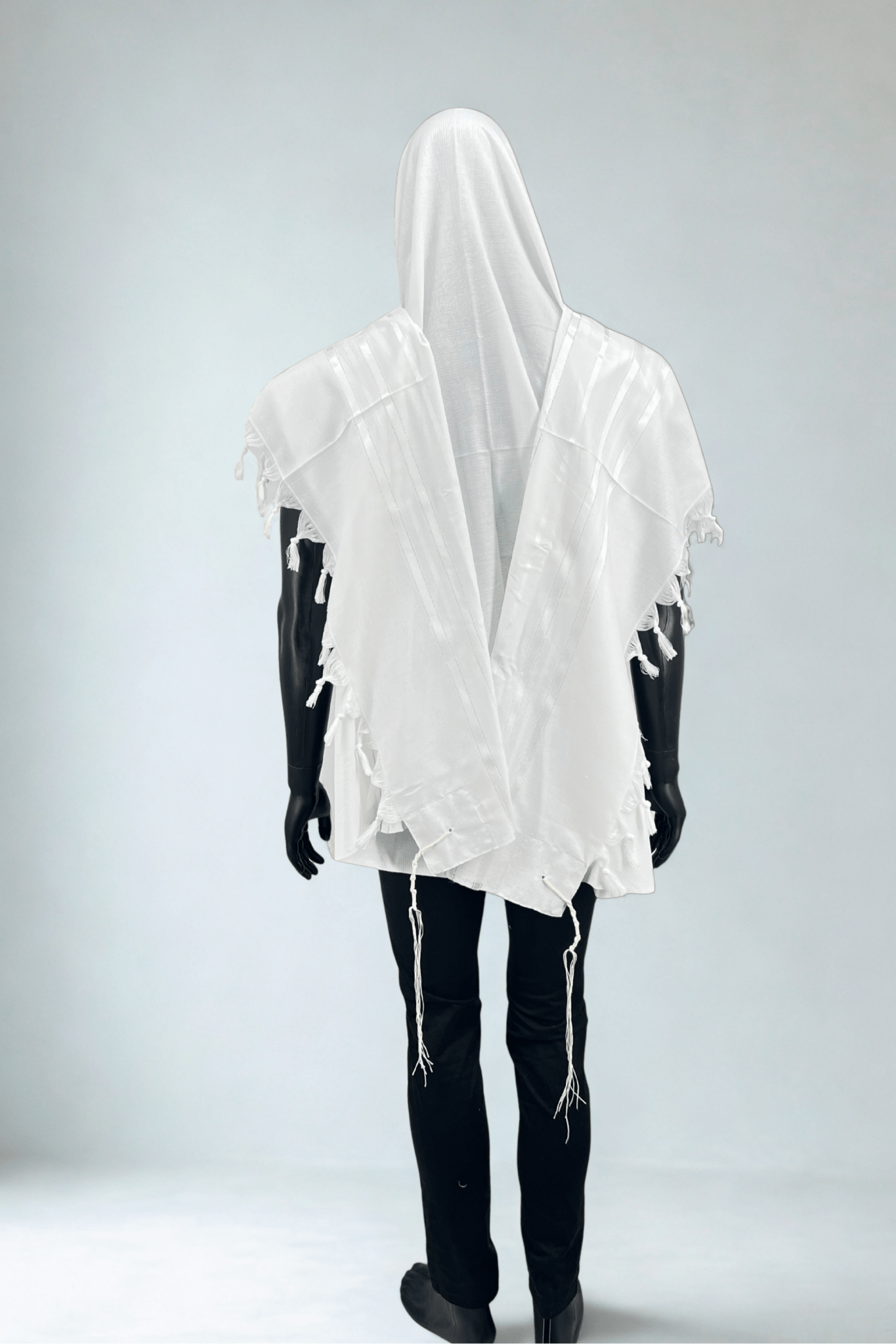 Full-length view of a mannequin wearing a white Tallit Chatanim made of acrylic fabric.