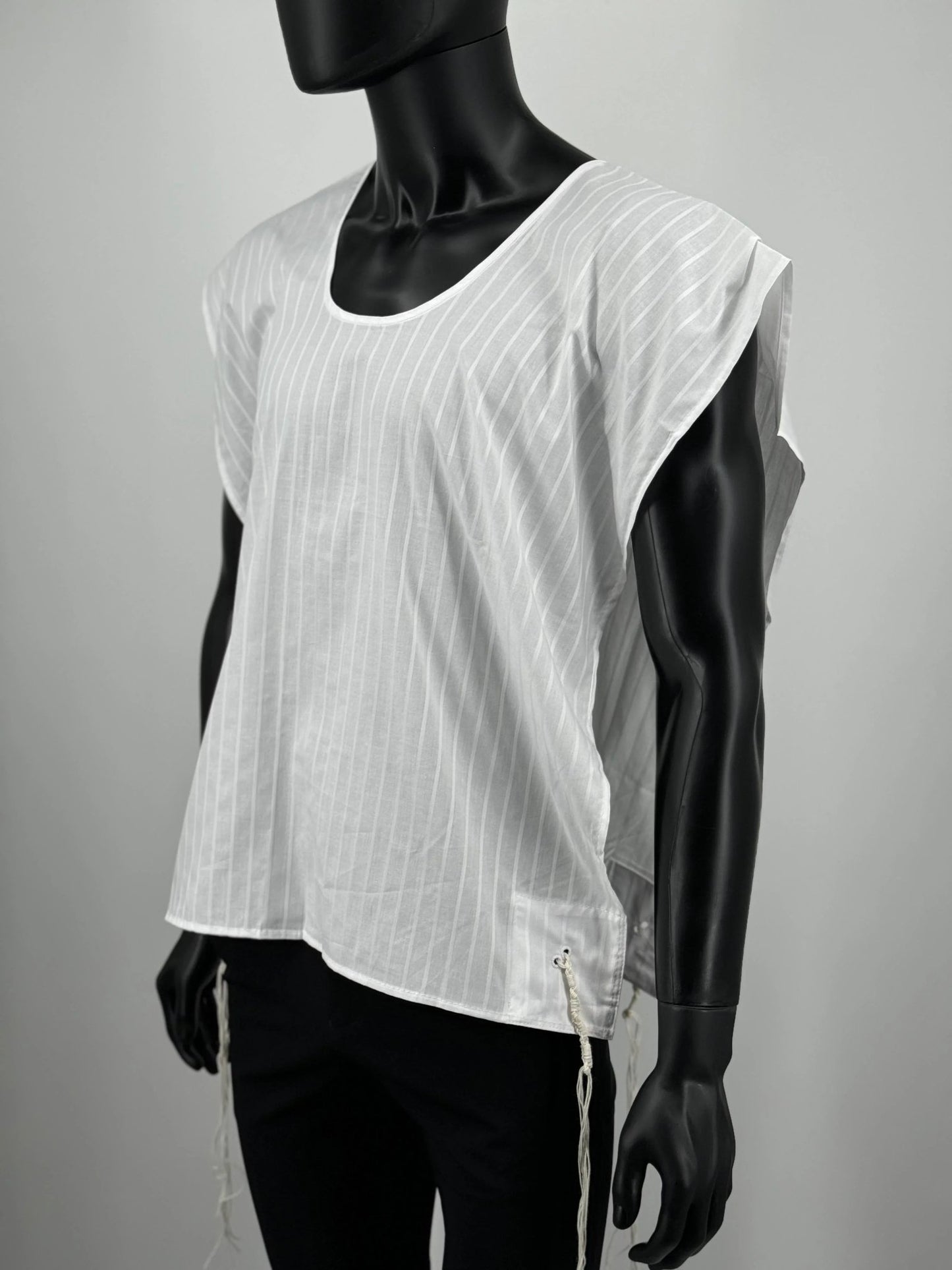 Mannequin wearing a white sleeveless Tzitzit T-shirt with a subtle pattern on a gray background