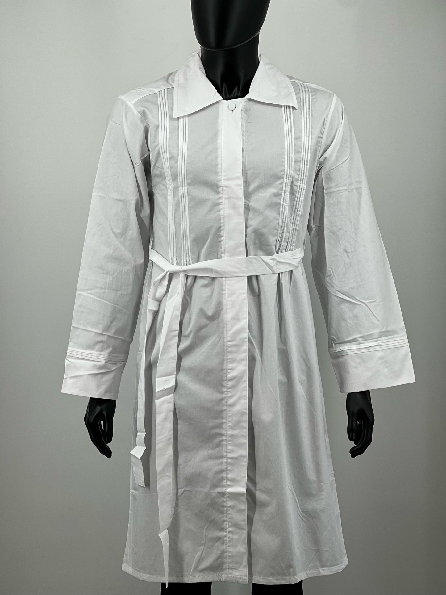 White Kittel on a mannequin against a plain background