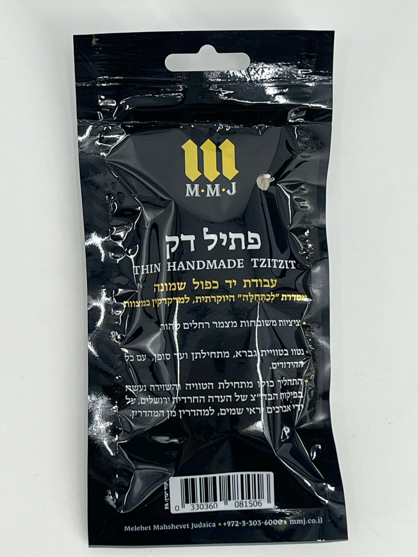 black package labeled “Thin Handmade Tzitzit” with white and gold Hebrew and English text, produced by M.M.J