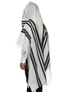 A person wearing a white and black striped tallit with fringes.