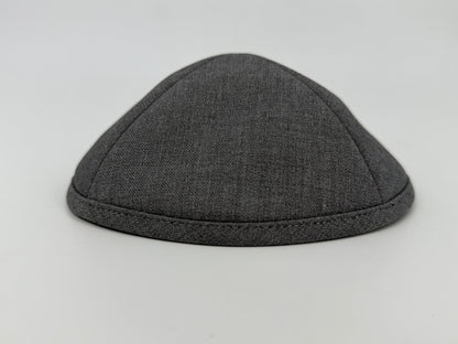 Gray fabric skullcap on a light gray background