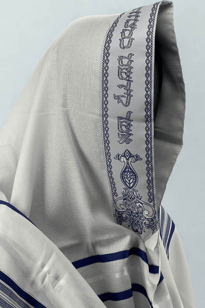 Close-up side view of a white Acrylic Tallit Chatanim with dark blue stripes and an embroidered atara (neckband)
