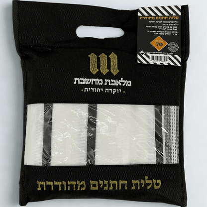 Black package with gold text and Tallit Chatanim  inside on a light gray background