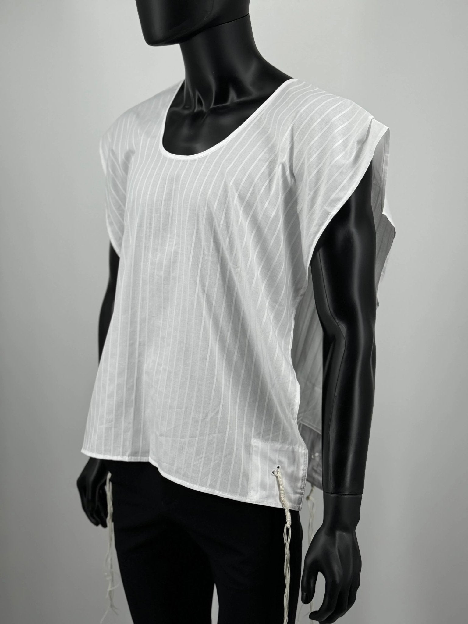 Mannequin wearing a white sleeveless Tzitzit T-shirt with a subtle pattern on a gray background