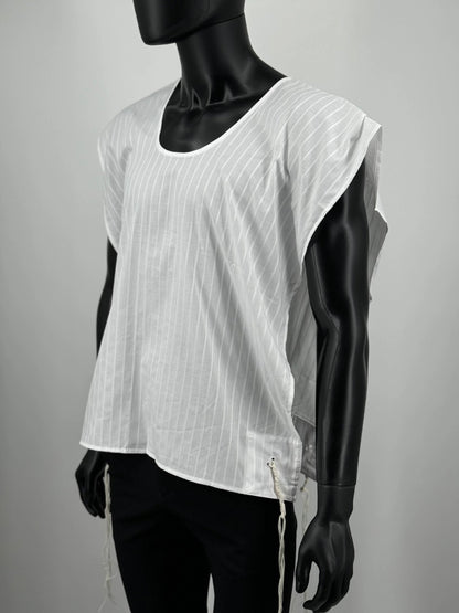 Mannequin wearing a white sleeveless Tzitzit T-shirt with a subtle pattern on a gray background