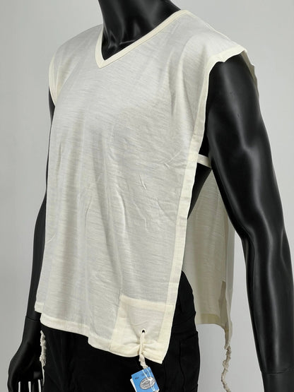 White wool Tzitzit T-shirt vest displayed on a mannequin torso. Made from 100% lamb’s wool, the garment features a wide halachic V-neck opening