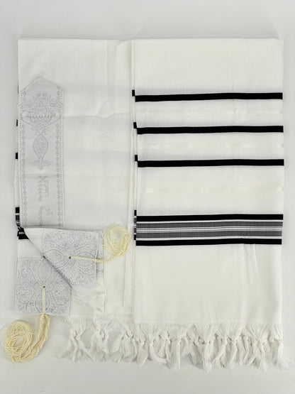 Flat-lay image of a white Acrylic Tallit Chatanim with black stripes and silver decorative elements.