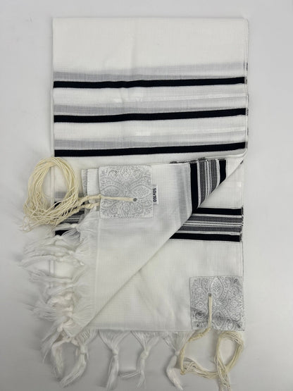A tallit scarf with black and white stripes and silver accents, displayed on a white background.