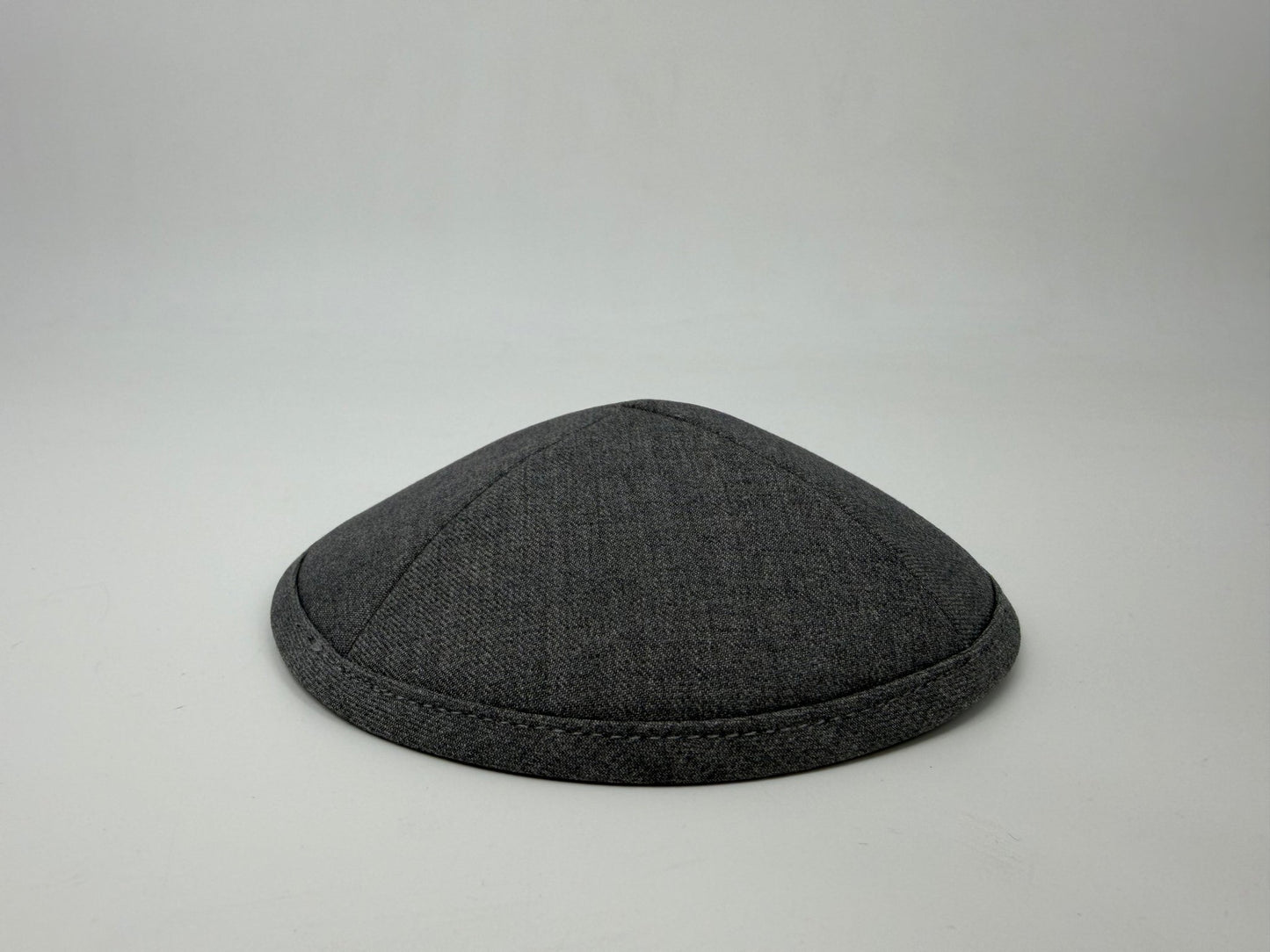Gray kippah on a light gray background