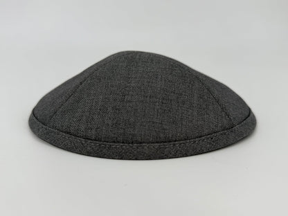 Dark gray kippah on a light gray background