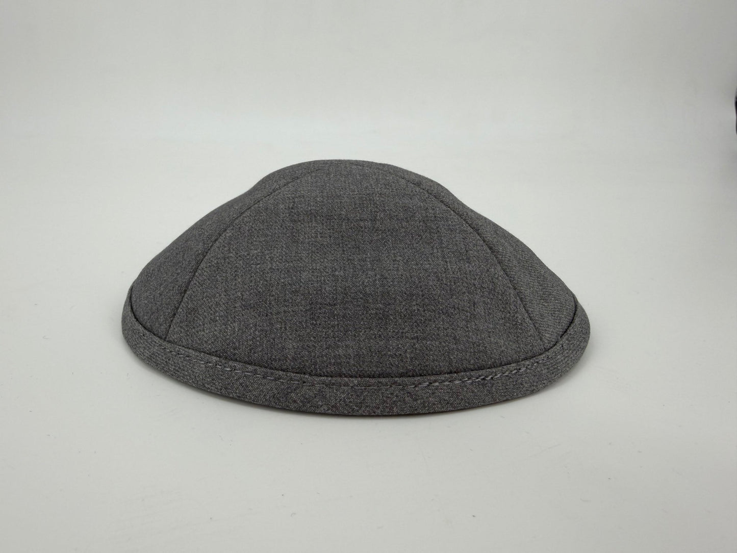 Gray kippah on a light gray background