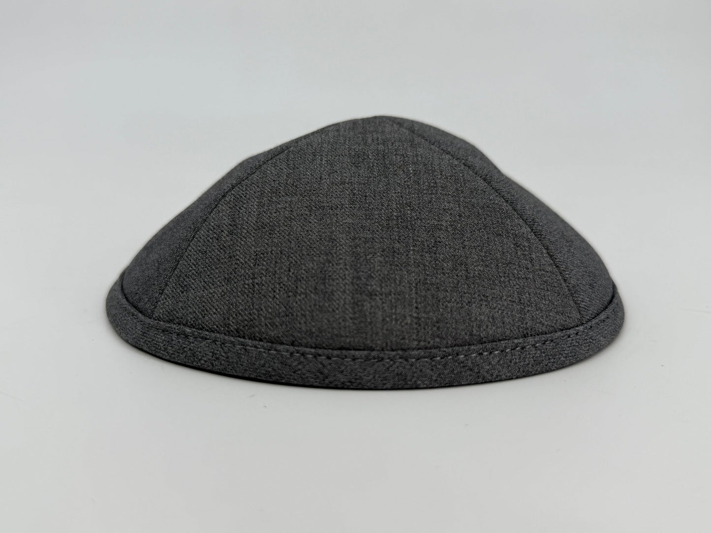 Gray kippah on a light gray background