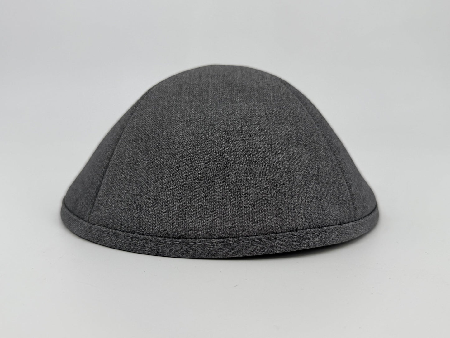 Gray fabric skull cap on a light gray background