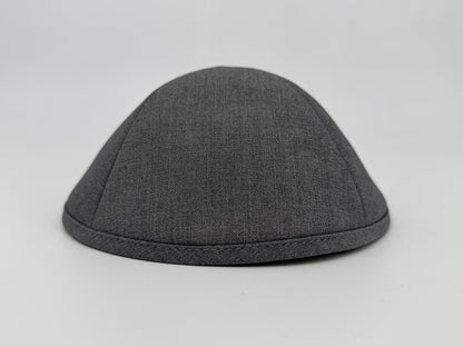 Gray fabric skull cap on a light gray background