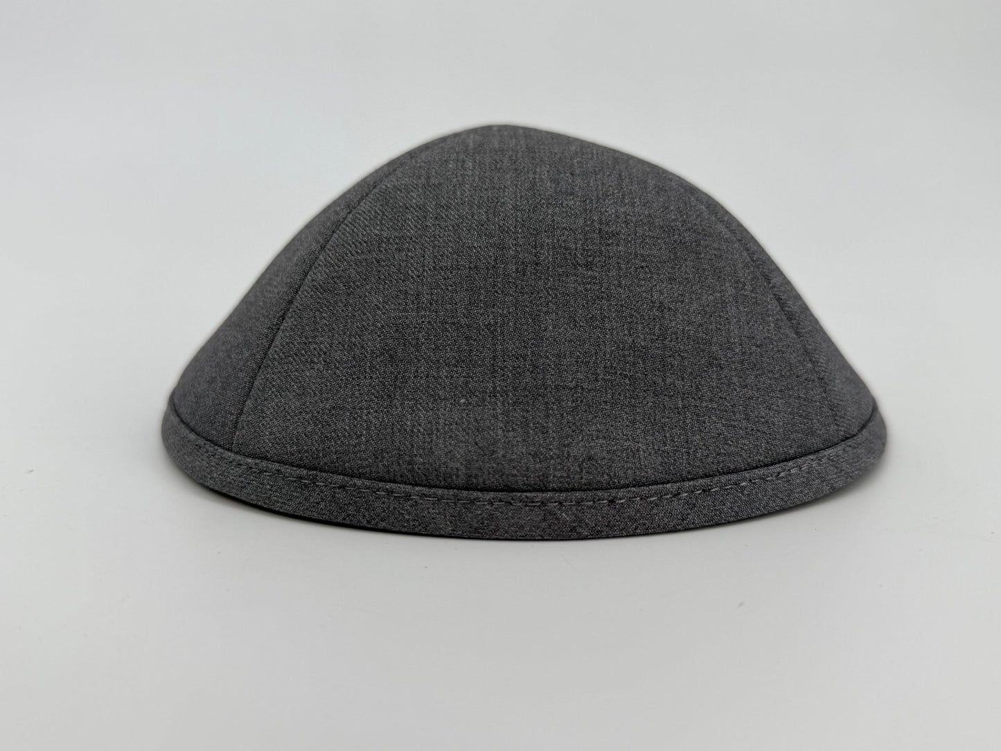 Gray kippah on a light gray background