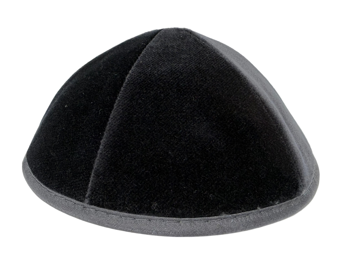 Black velvet kippah on a white background