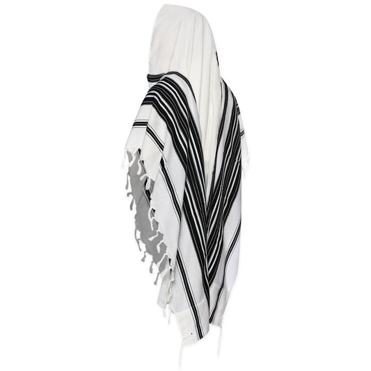 A traditional Jewish tallit, featuring a striped pattern in black and white, displayed on a white background.