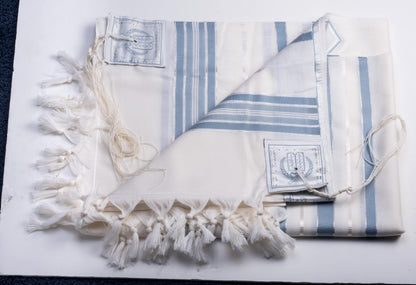 White tallit gadol with blue stripes  on a white background