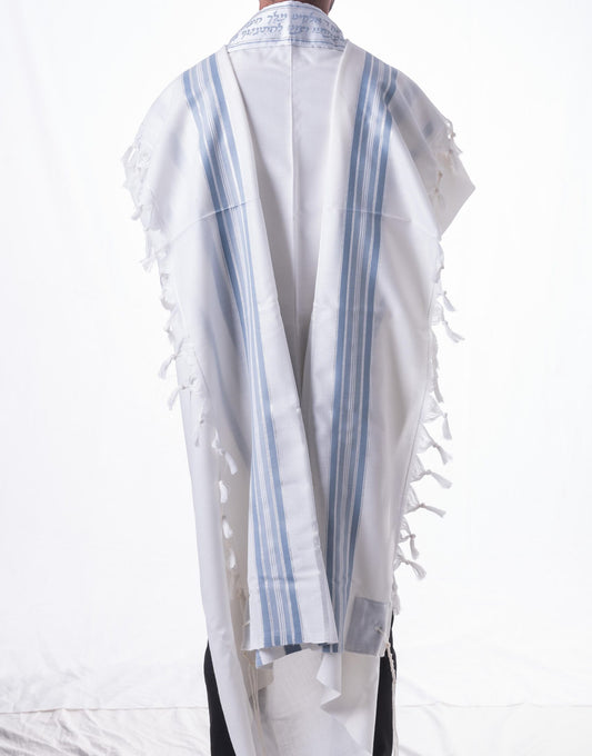 White wool tallit katan with blue stripes and fringes on a white background