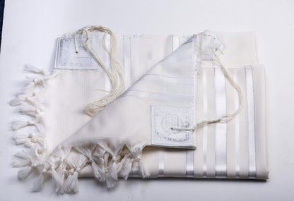 White prayer shawl with tassels on a white background