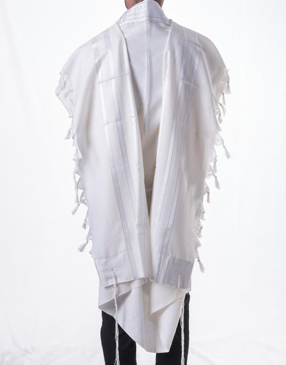White prayer  shawl with fringe details on a white background