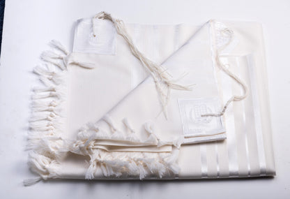 White wool tallit katan  with tzitzit on a white background