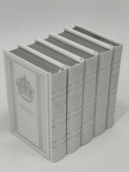 Five-volume Sha'arav B'Todah Sephardi Machzor set in elegant white faux leather with embossed Hebrew titles and crown design. Each volume corresponds to a major Jewish holiday: Rosh Hashanah, Yom Kippur, Sukkot, Pesach, and Shavuot. Decorative detailing enhances the spine and cover.