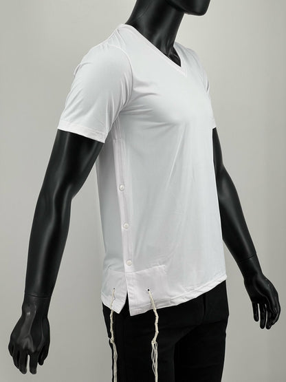 Side view of a mannequin wearing a white moisture-wicking V-neck Tzitzit T-shirt. The shirt features breathable mesh fabric, snap buttons along the side, and white Tzitzit strings hanging from the corners. Designed for comfort and daily wear.