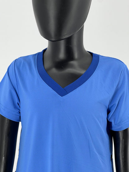Close-up view of a mannequin wearing a blue V-neck short-sleeve Tzitzit T-shirt. The textured fabric and reinforced neckline are clearly visible. The image focuses on the upper torso, with no visible face or lower body. Displayed against a plain light background.