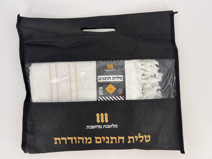 Black carry bag with gold and white Hebrew text, containing a folded acrylic Tallit Chatanim with gold stripes.