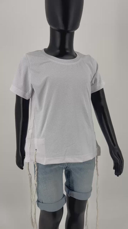 Video of Mannequin dressed in a white round-neck short-sleeve Tzitzit T-shirt with a breathable mesh texture, featuring white Tzitzit fringes hanging from the garment's corners. The shirt includes white side buttons and is paired with light blue denim shorts. Displayed against a plain light background.