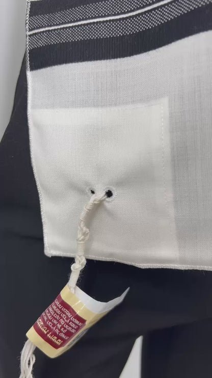 Video of red and yellow kosher certification tag in Hebrew is attached, indicating the tzitzit were handmade according to halachic standards.